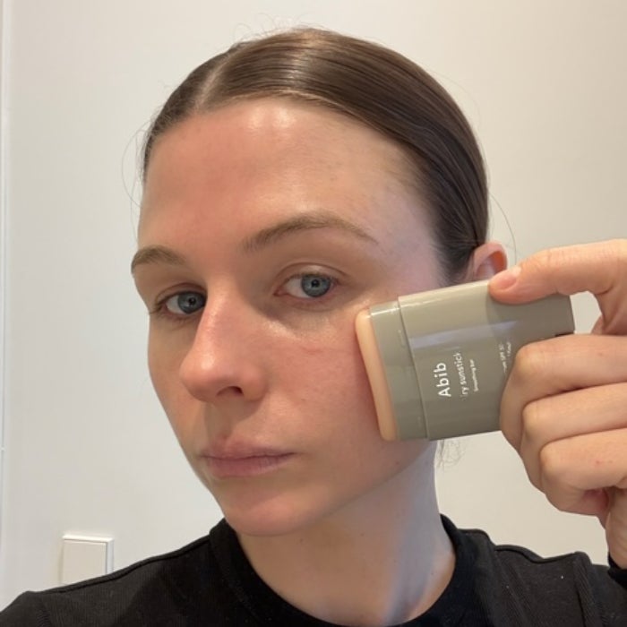 Allison Wall testing the Abib Airy Sunstick Smoothing Bar SPF 50+