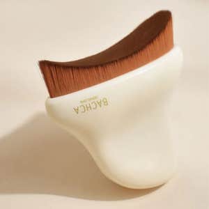 Bachca; the Lymphatic Drainage Face Brush against a neutral background