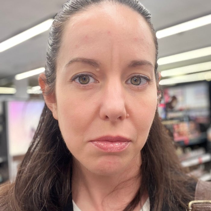 Brittany Brainard's face after applying Patrick Ta Major Volume Plumping Lip Gloss against a natural background