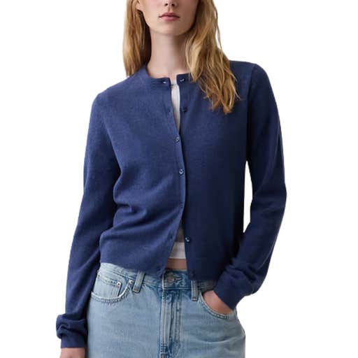 A woman wearing a blue GAP CashSoft Crop Cardigan against a white background