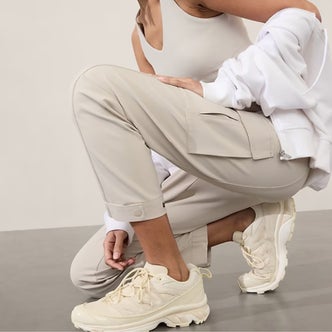 Quince; a woman wearing Vintage Wash Tencel Drawstring Cargo Pants against a neutral background