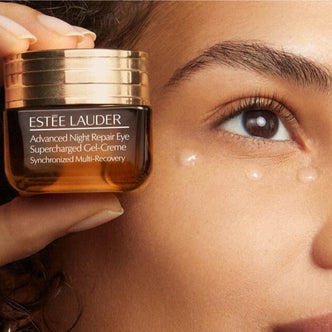 Sephora; a jar of Estée Lauder  Advanced Night Repair Eye Supercharged Gel Eye Cream with Hyaluronic Acid and Vitamin E in front of a close up view of a woman's face