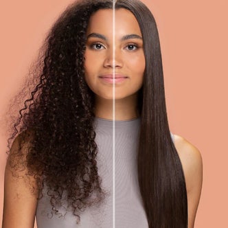 a woman with straight hair on the right and curly hair on the left against a light orange background