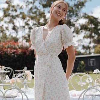 woman wearing a floral cotton midi dress