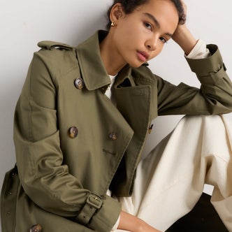Quince; a woman wearing Quince Comfort Stretch Long Trench Coat against a neutral background