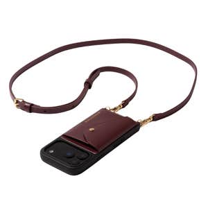 Bandolier; Donna Crossbody Phone Case in Wine/Gold against a white background