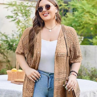 Amazon; a woman wearing IN'VOLAND Plus Size Lightweight Crochet Cardigan against a natural background