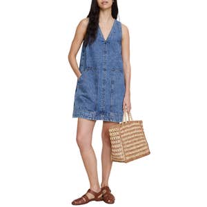 Banana Republic; a woman wearing Banana Republic Denim Shift Dress