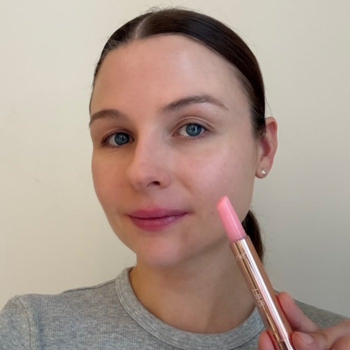 Allison Wall's face after applying tarte Maracuja Juicy Lip Plump against a white background