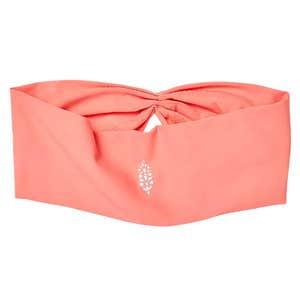 A pink FP Movement Slam Dunk Silicone Grip Soft Headband against a white background