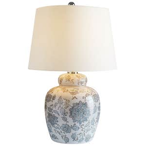 ceramic table lamp with off white shade on white background