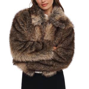 Anthropologie; a woman wearing Maeve Rae Faux Fur Crop Jacket