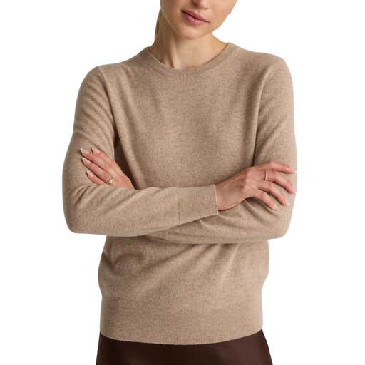 A woman wearing a Quince Mongolian Cashmere Crewneck Sweater against a white background
