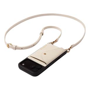 Bandolier; Donna Crossbody Phone Case in Ivory/Gold against a white background