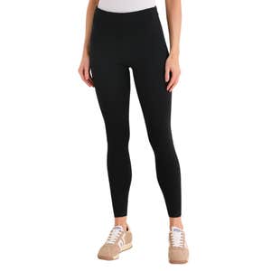 Tuckernuck; a woman wearing Black High Rise Compression September Leggings