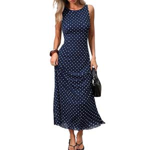 Amazon; a woman wearing a nave and white polka dot dress
