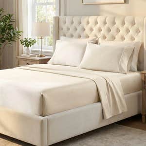 ivory cotton embroidery sheet set in bedroom setting