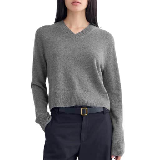 a woman wearing Everlane Cashmere Cropped High-V Sweater against a white background